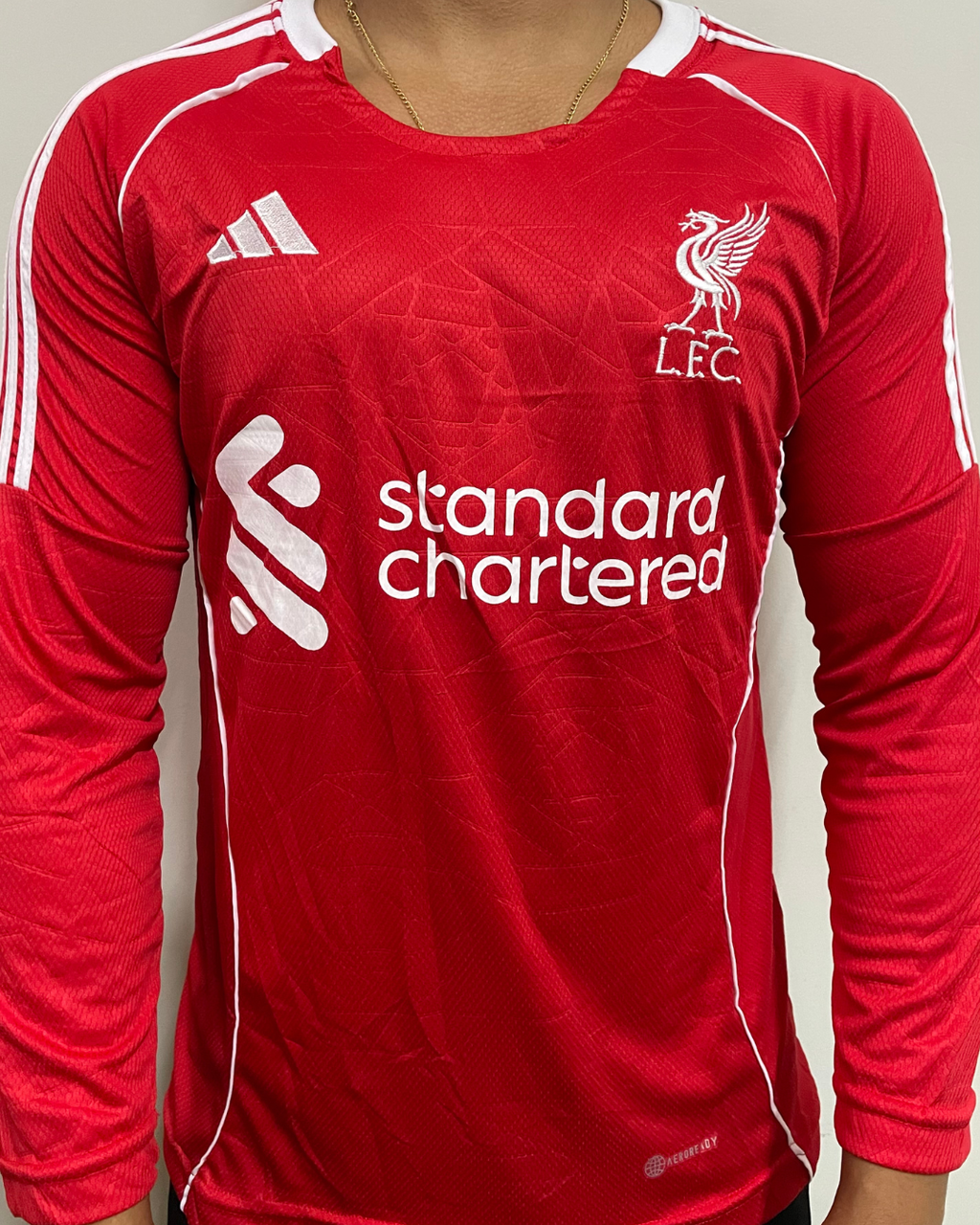 15491719516-catalogo-0ab06085aa1997e80a17681667837514-1024-1024.png Camisa Liverpool Trad Vermelha 2025/26 Manga Longa - Imagem 1